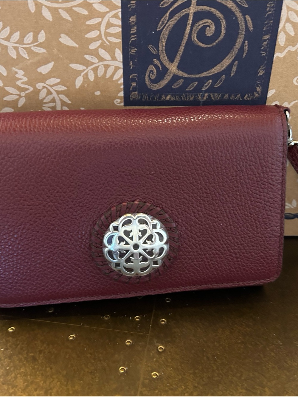Brighton Burgundy Leather Clutch with Silver Medallion